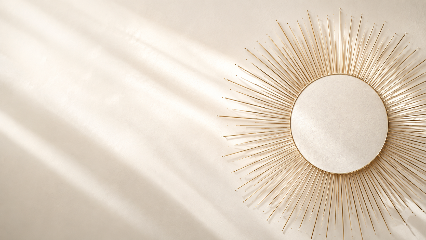 Ivory architectural surface with a radiant gold sunburst